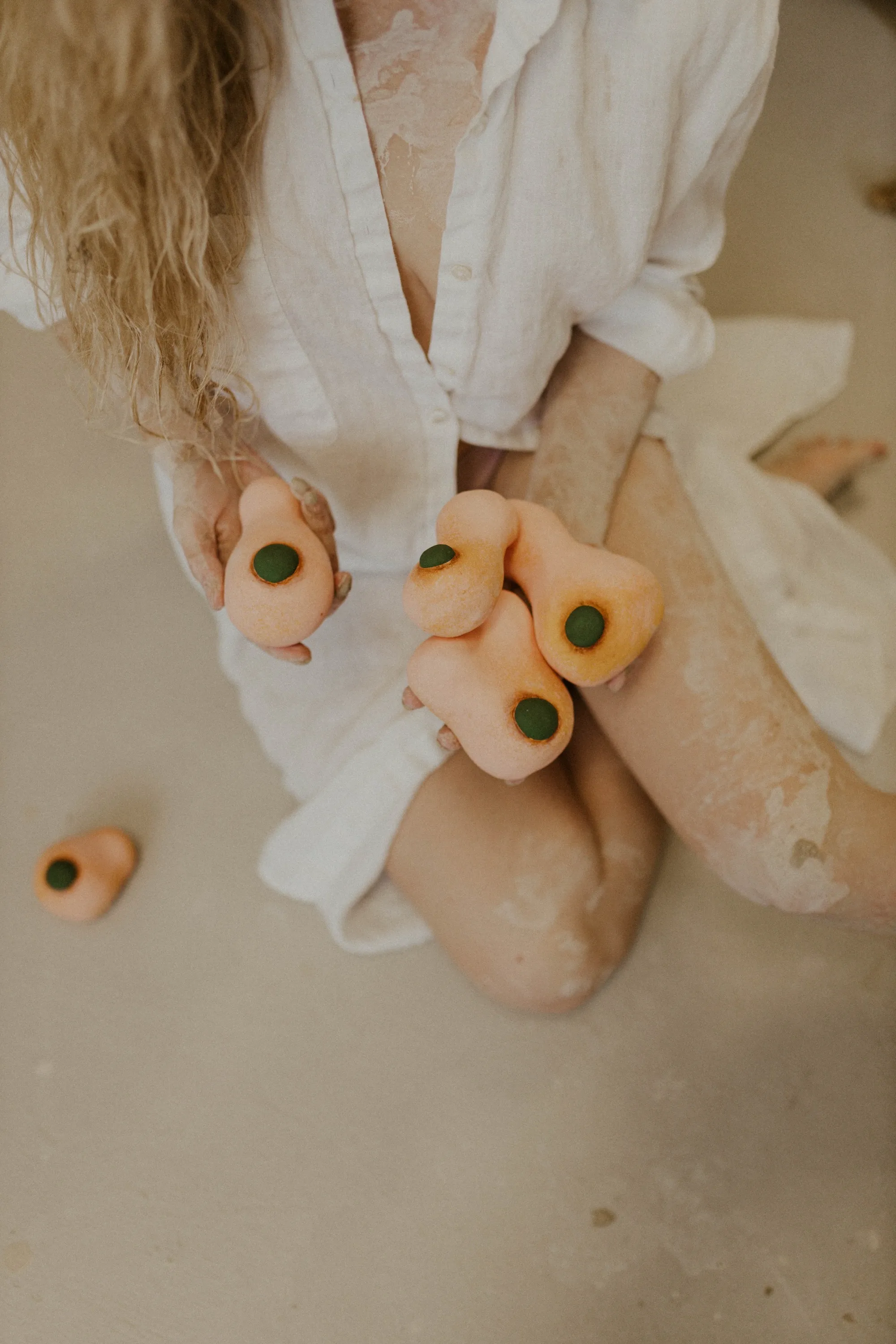 Sarah holding peach bud vases, overhead angle